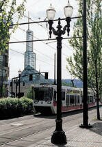 The MAX heading downtown with the Convention Center in the background.