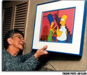 PORTLAND TRIBUNE Margaret Groening says her animation cell of Homer and Marge Simpson, from "The Simpsons" TV show, is one of her prize possessions. Her son, Matt, gave it to her as a Christmas present.