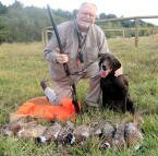 Carl Jorgensen with his Pudelpointer, Brandi after a successful hunt.